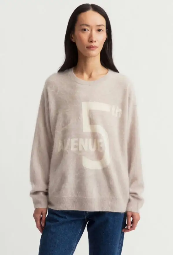Full body studio look of light oat 18GG brushed cashmere graphic print loose crew neck sweater matched with blue jeans, fuzzy halo fleece cashmere casual everyday women knit pullover