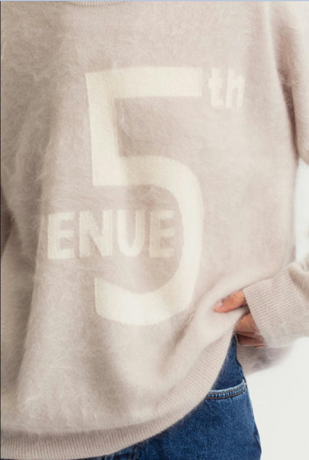 Close-up texture shot of light oat 18GG brushed cashmere graphic print loose crew neck sweater, large number letter print fuzzy halo cashmere knit fabric detail, casual soft women fleece pullover