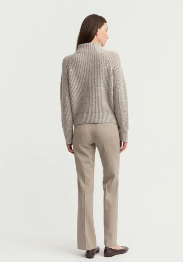 Back view full studio shot of light grey 5GG cashmere blend ribbed mock neck sweater with beige straight leg wool trousers, vertical rib knit slim turtleneck knit top minimalist business casual women outfit