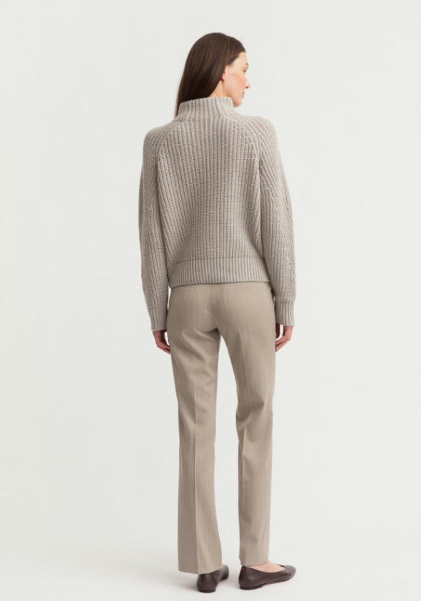 Back view full studio shot of light grey 5GG cashmere blend ribbed mock neck sweater with beige straight leg wool trousers, vertical rib knit slim turtleneck knit top minimalist business casual women outfit
