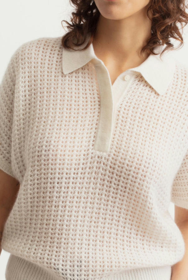 Half-body studio shot of off-white cashmere cotton openwork polo short sleeve sweater, breathable mesh hollow knit collared knit top, minimalist summer luxury women polo knitwear
